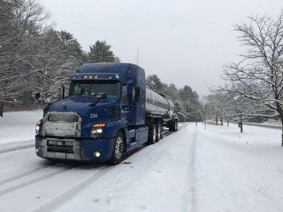 Highway Transport tank truck in snow winter safety tips for truck drivers