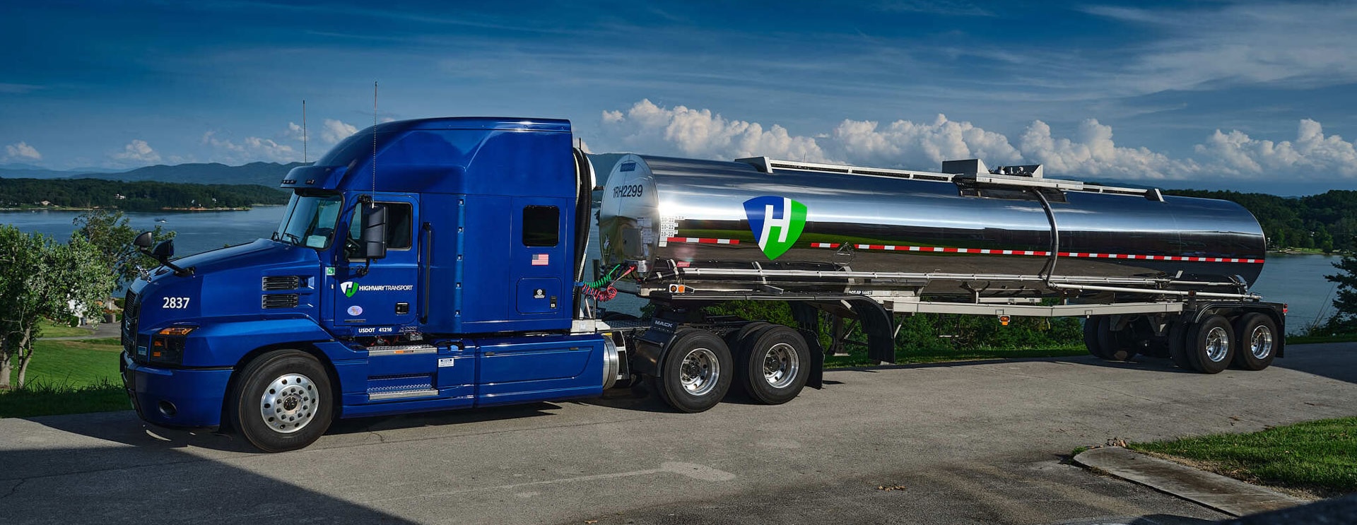 Highway Transport tanker truck by a lake