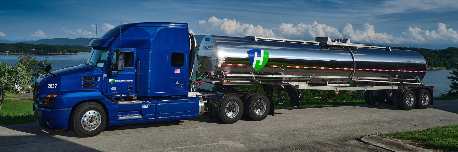Highway Transport tanker truck by a lake